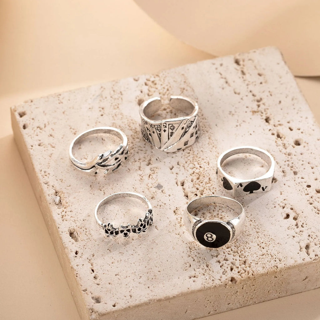 Black alloy ring featuring a detailed retro spade card design on an adjustable band.