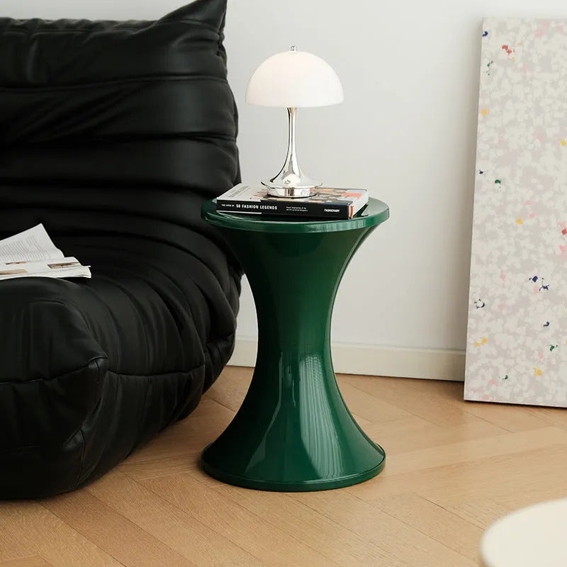 Plastic hourglass shoe changing stool in multiple colours with compact dimensions