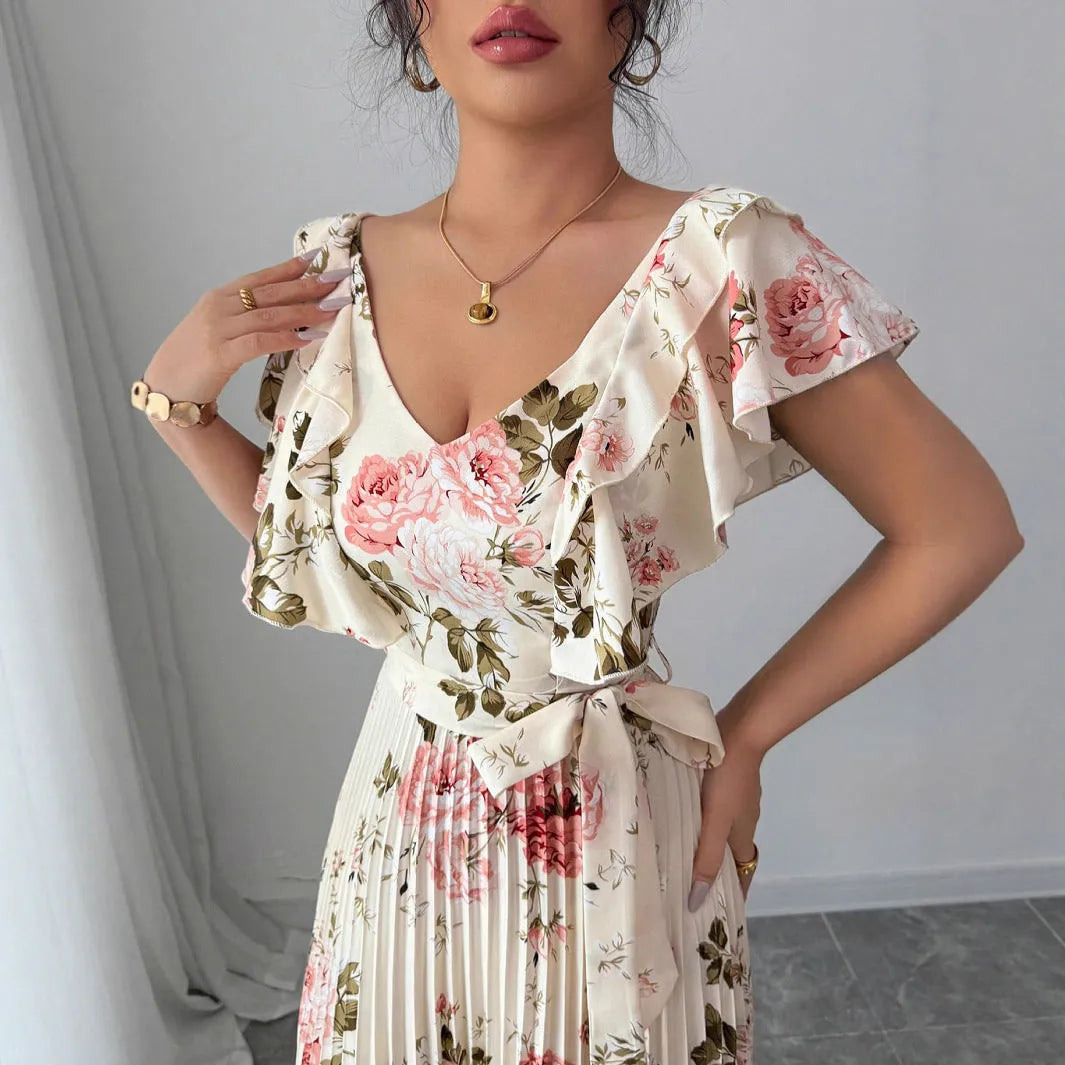 Apricot floral print women's dress with V-neck, ruffle sleeves, and a high-waisted swing skirt.