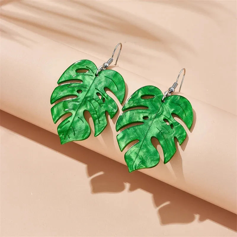 Drop shape earrings with a white acrylic coconut artocarpus charm and silver alloy hook.