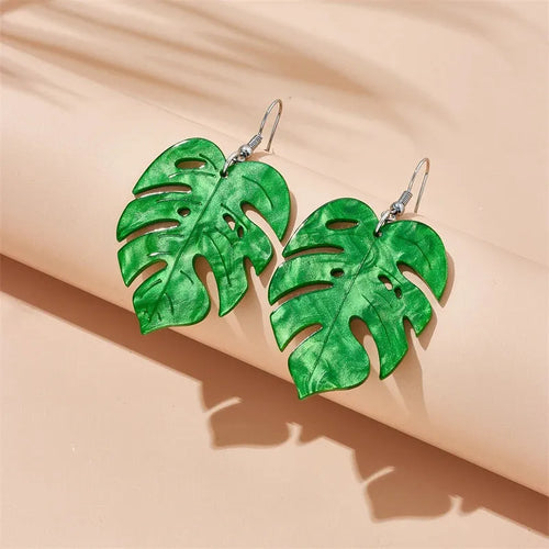 Drop shape earrings with a white acrylic coconut artocarpus charm and silver alloy hook.