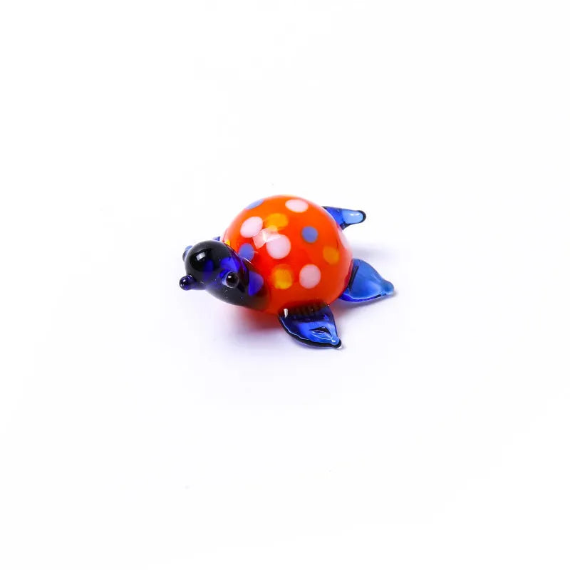 Glass crafts home ornament geometric turtle shape in blue and blue shell on desktop
