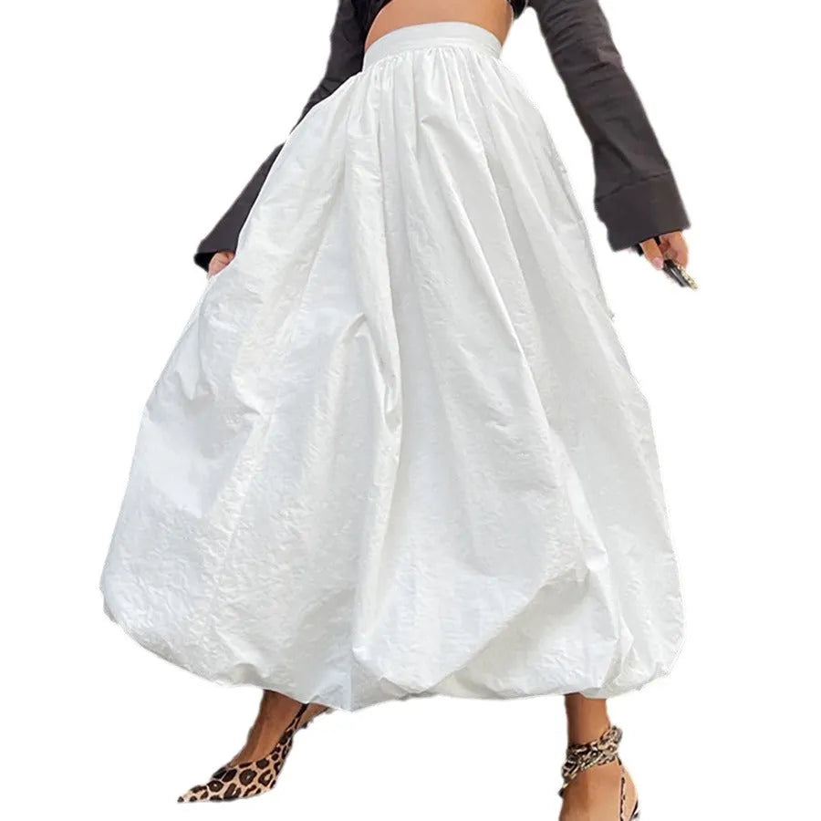 Women's solid colour cotton long skirt with elastic waistband in black or white.