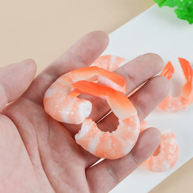 White PVC shrimp simulation keychain with metal door buckle, shown from the side to highlight its 1.5cm thickness.