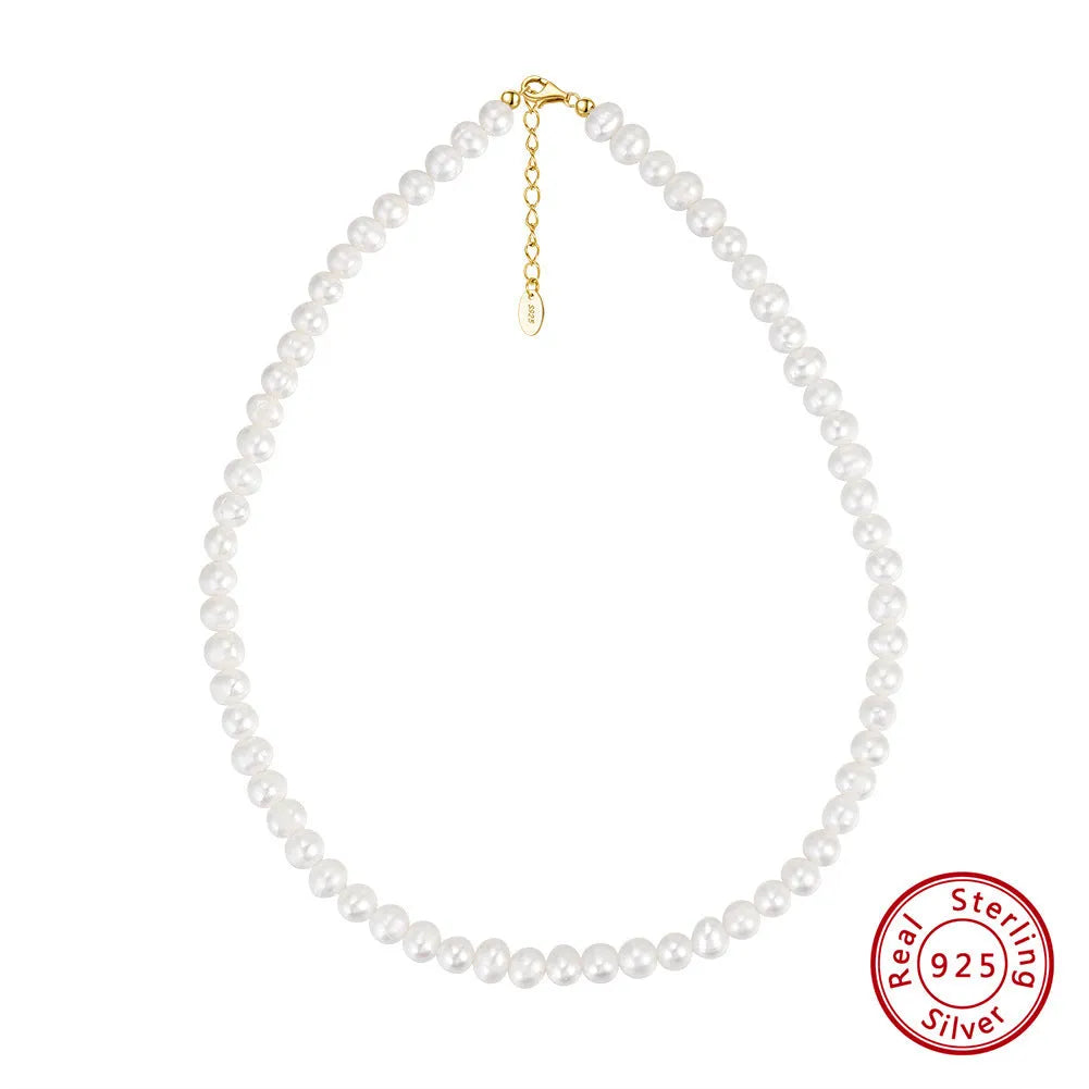 Close-up of a women's adjustable necklace with freshwater pearls on a sterling silver chain.