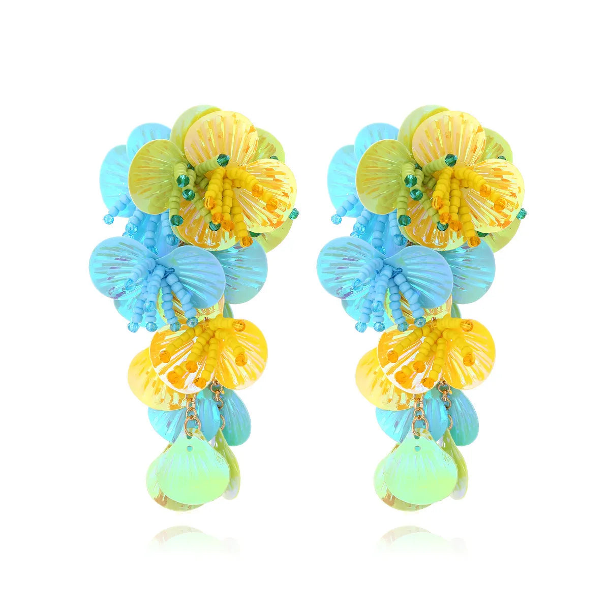 A pair of handmade colourful string bead flower and leaf earrings in an exaggerated design.