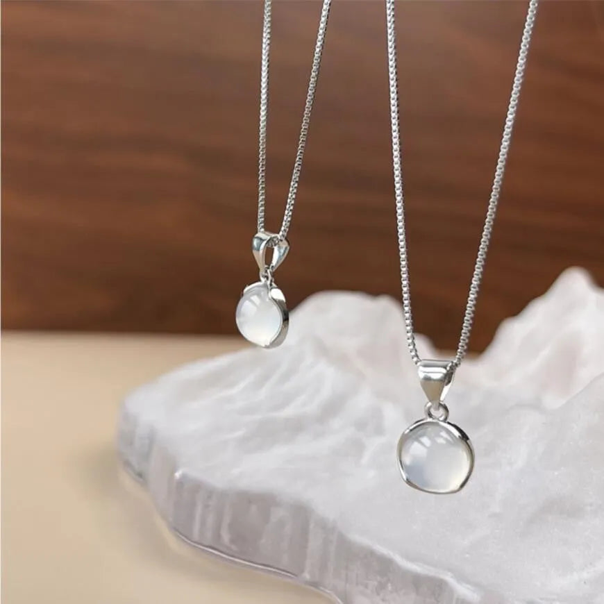 Women's Korean-style simple oval pendant necklace with artificial crystal pendant on box chain in X7 6 Moon Light colour, geometric eight Awn star design