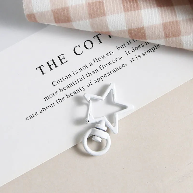 Metal five-pointed star snap button keychain with colour paint finish in alloy, small size, thirteen colour options including beige and sapphire blue