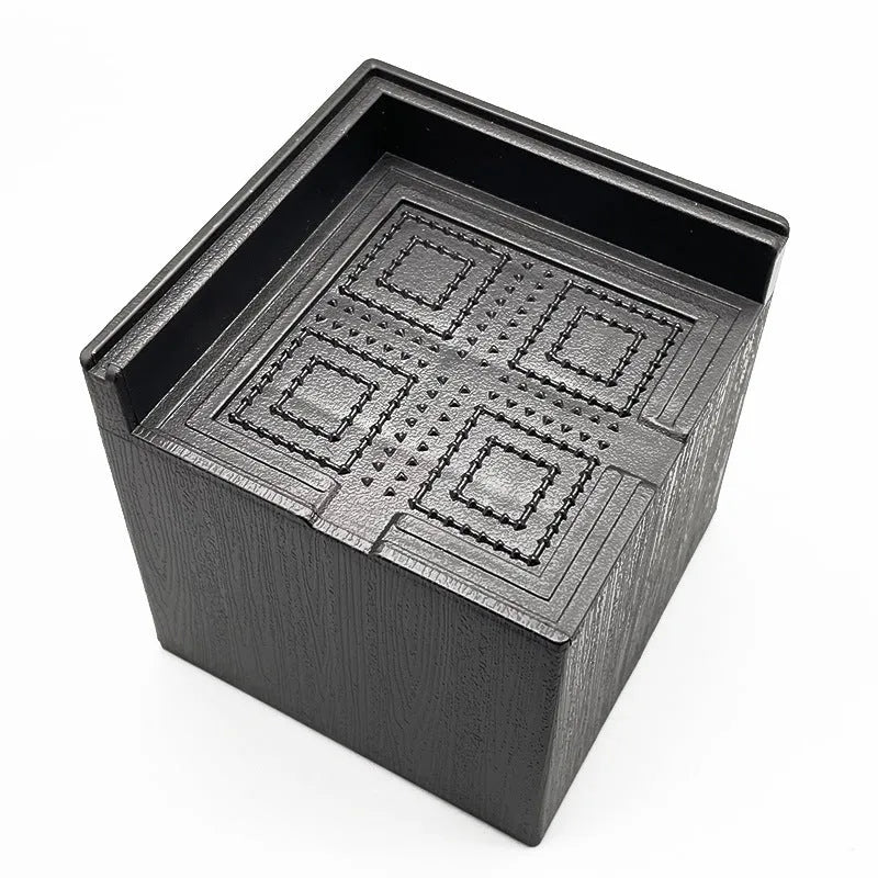 Four black plastic furniture height adjustment mats for bed and sofa legs
