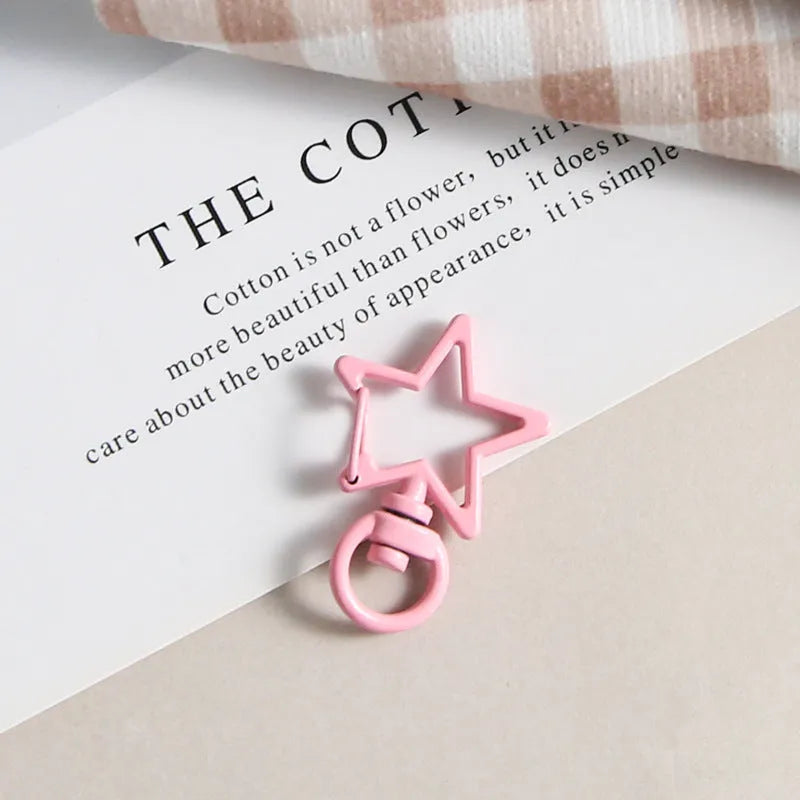 Metal five-pointed star snap button keychain with colour paint finish in alloy, small size, thirteen colour options including beige and sapphire blue