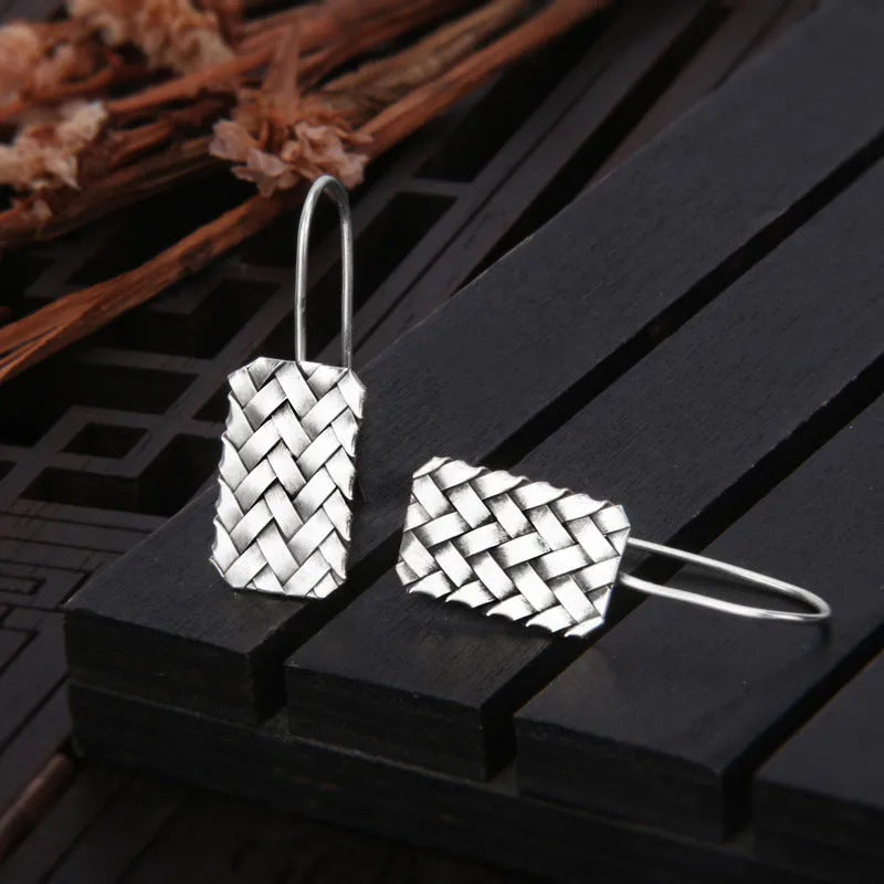 Silver geometric woven plaid earrings measuring 17.5mm by 11mm