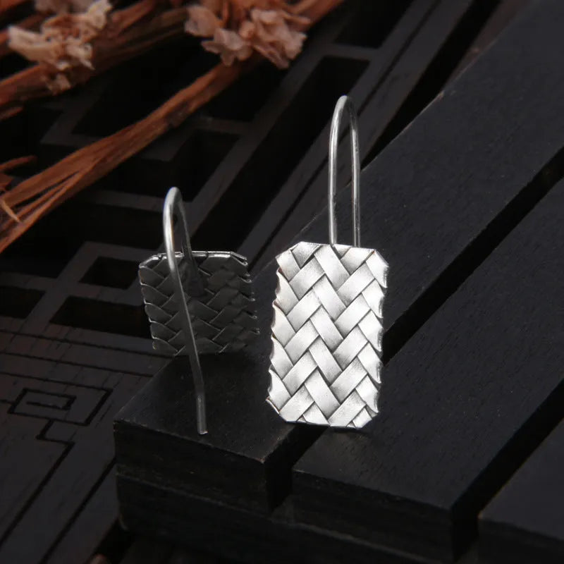 Silver geometric woven plaid earrings measuring 17.5mm by 11mm