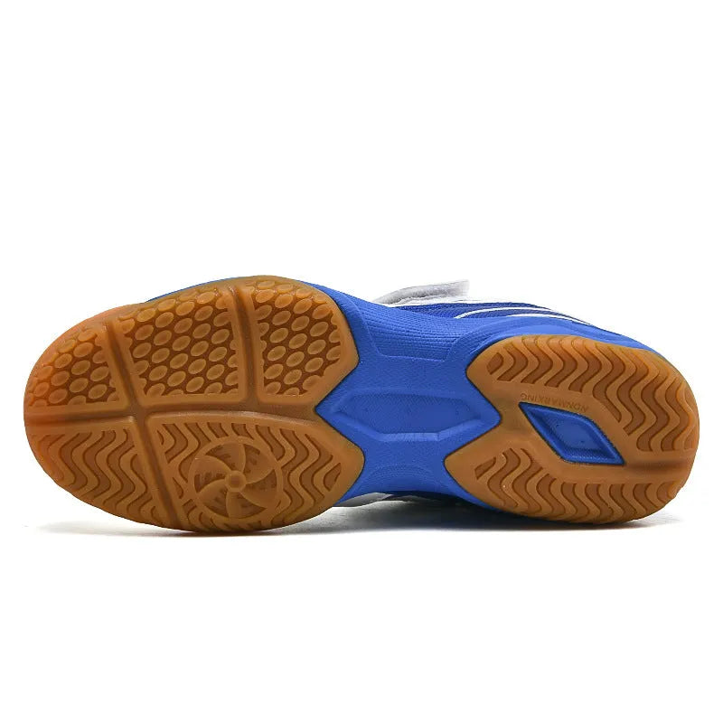White and blue badminton shoes with PVC upper, rib bottom sole, and low-top wedge design