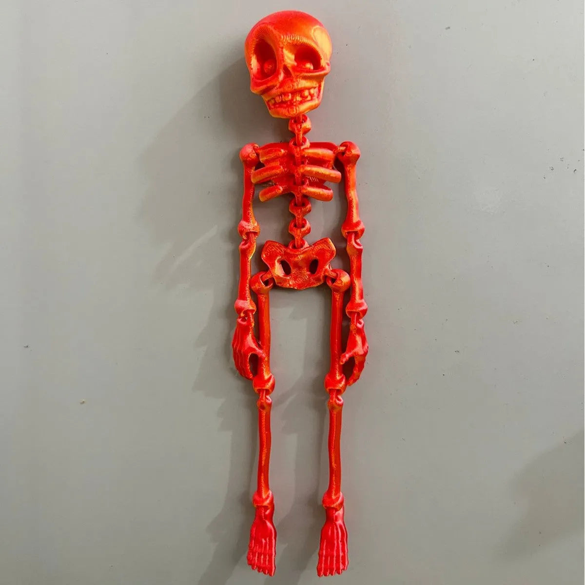 3D printed PLA plastic skull refrigerator magnet in modern art style, 18cm tall.