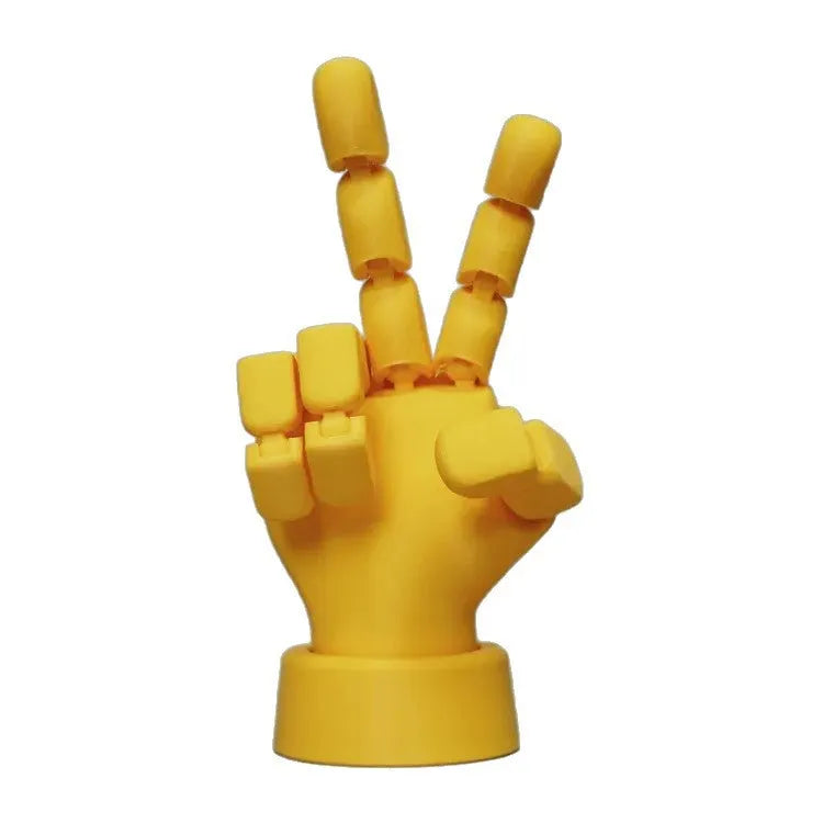 Yellow movable joint hand prop ornament made from PLA plastic.