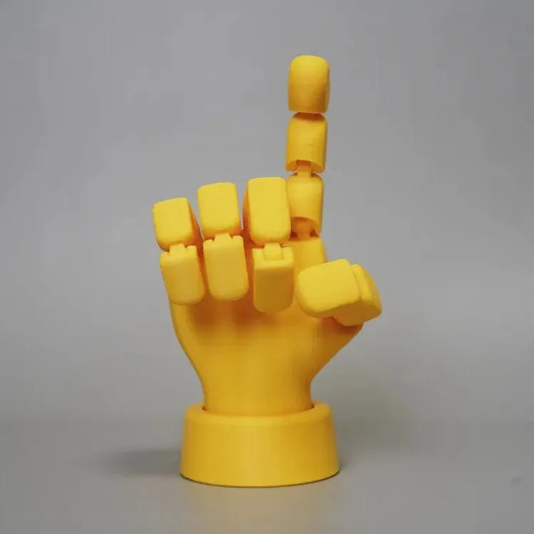Yellow movable joint hand prop ornament made from PLA plastic.