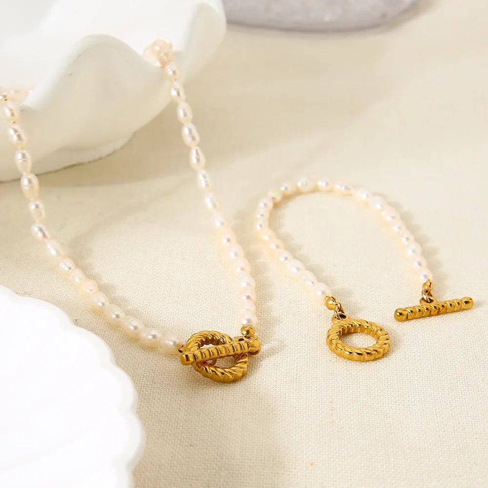 Women's adjustable freshwater pearl necklace and bracelet set with geometric stainless steel pendant