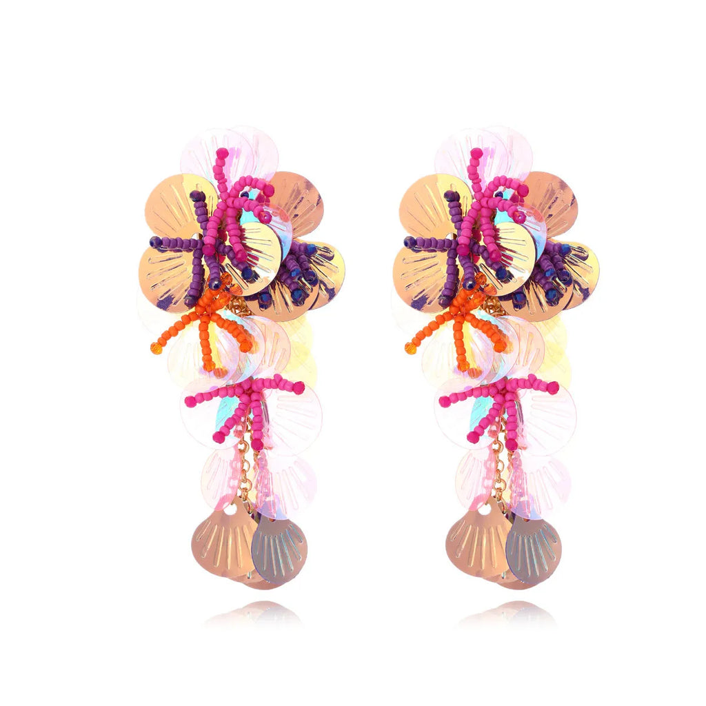 A pair of handmade colourful string bead flower and leaf earrings in an exaggerated design.