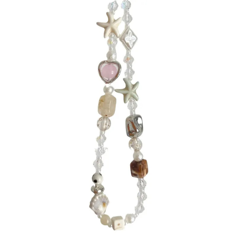 Bohemian style mobile phone charm with beach camera design in island sweetheart colours and alloy construction