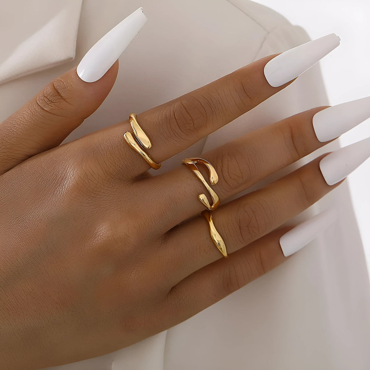 Women's irregular water drop ring suit 3-piece set in gold alloy on white background
