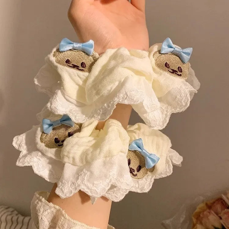 Bear blue large intestine hair ring with a cloth bow and lace detail on a stretchable headband.
