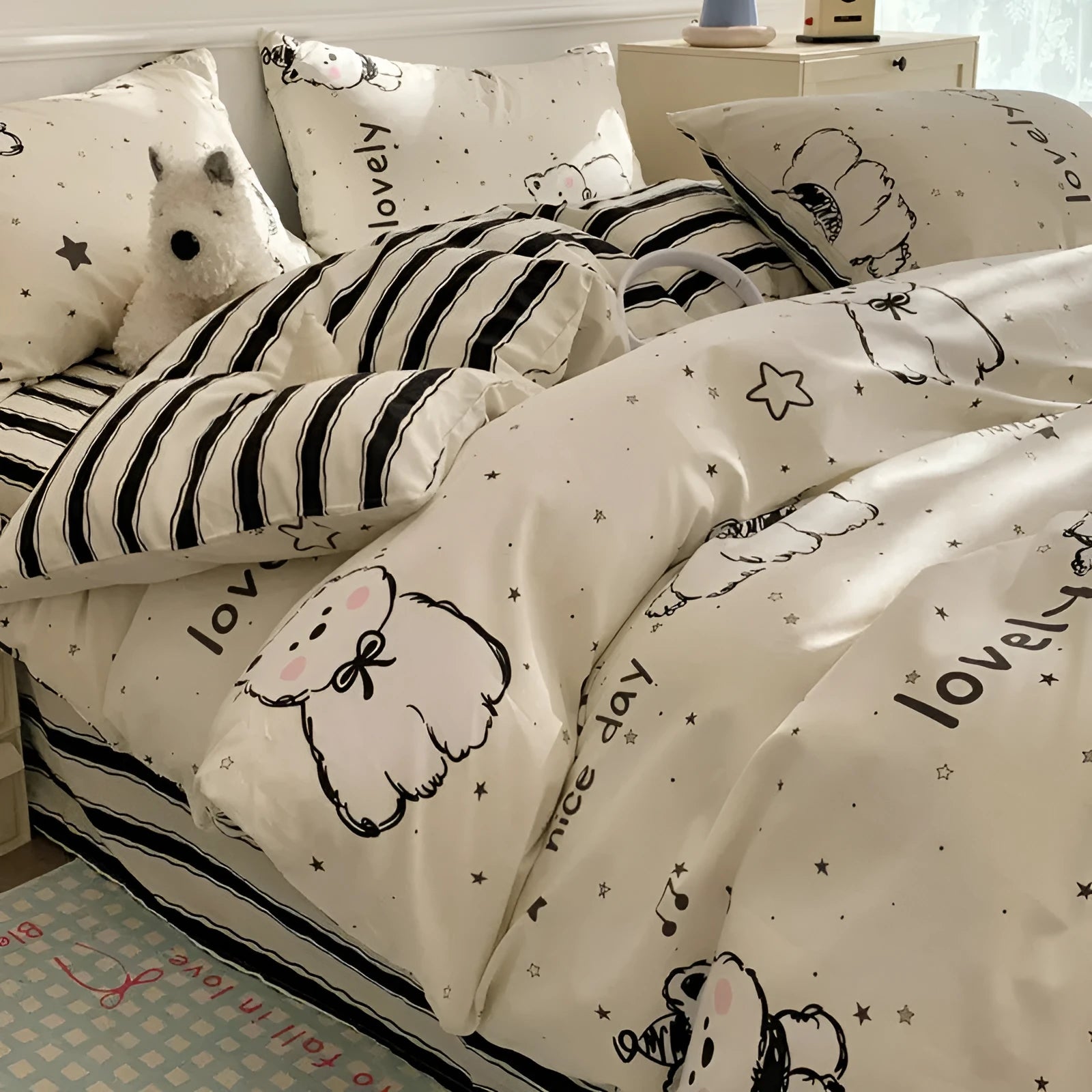 Cartoon dog pattern on a pure cotton duvet cover and pillowcases from a four-piece bedding set.