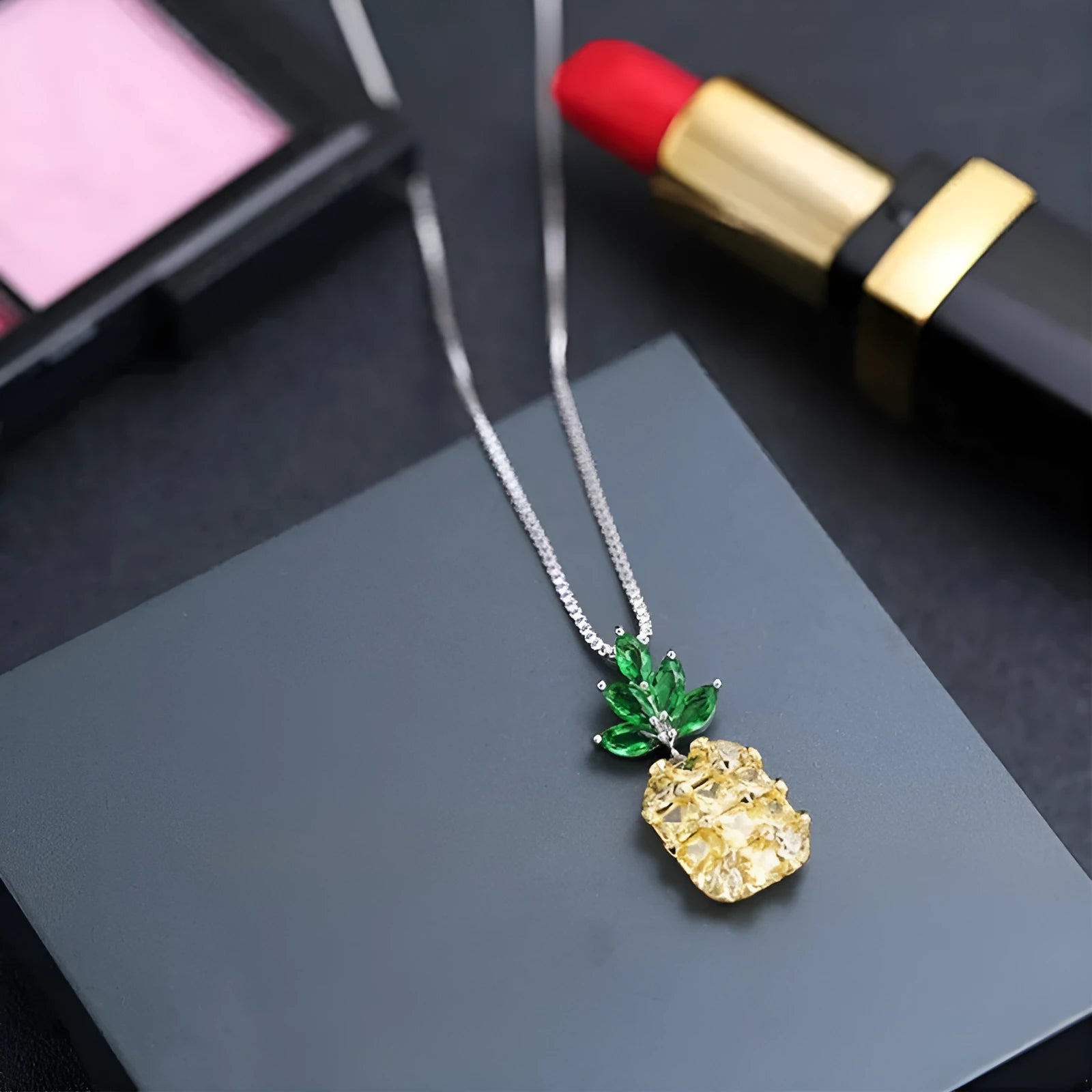 Silver geometric pineapple diamond necklace on white background