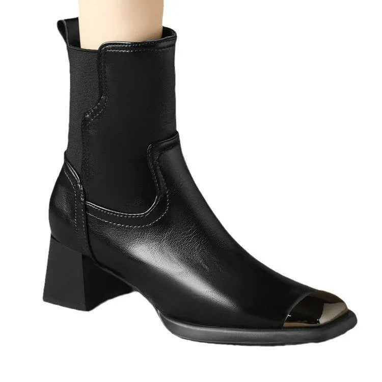 Brown cowhide leather women's Martin boots with a high heel and side zipper detail.