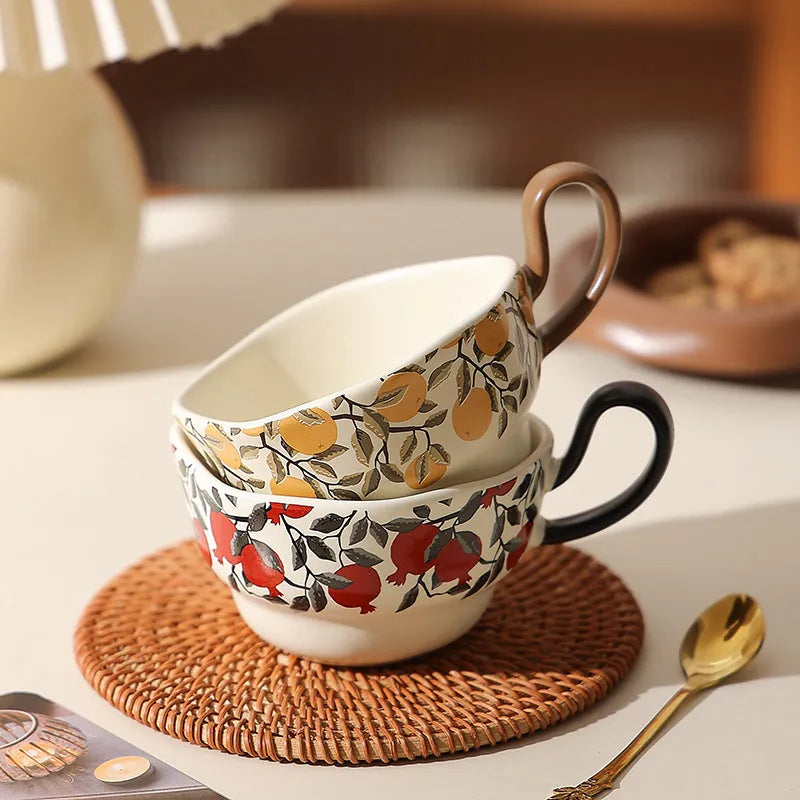 Antique-style black ceramic coffee cup and saucer set on a wooden table