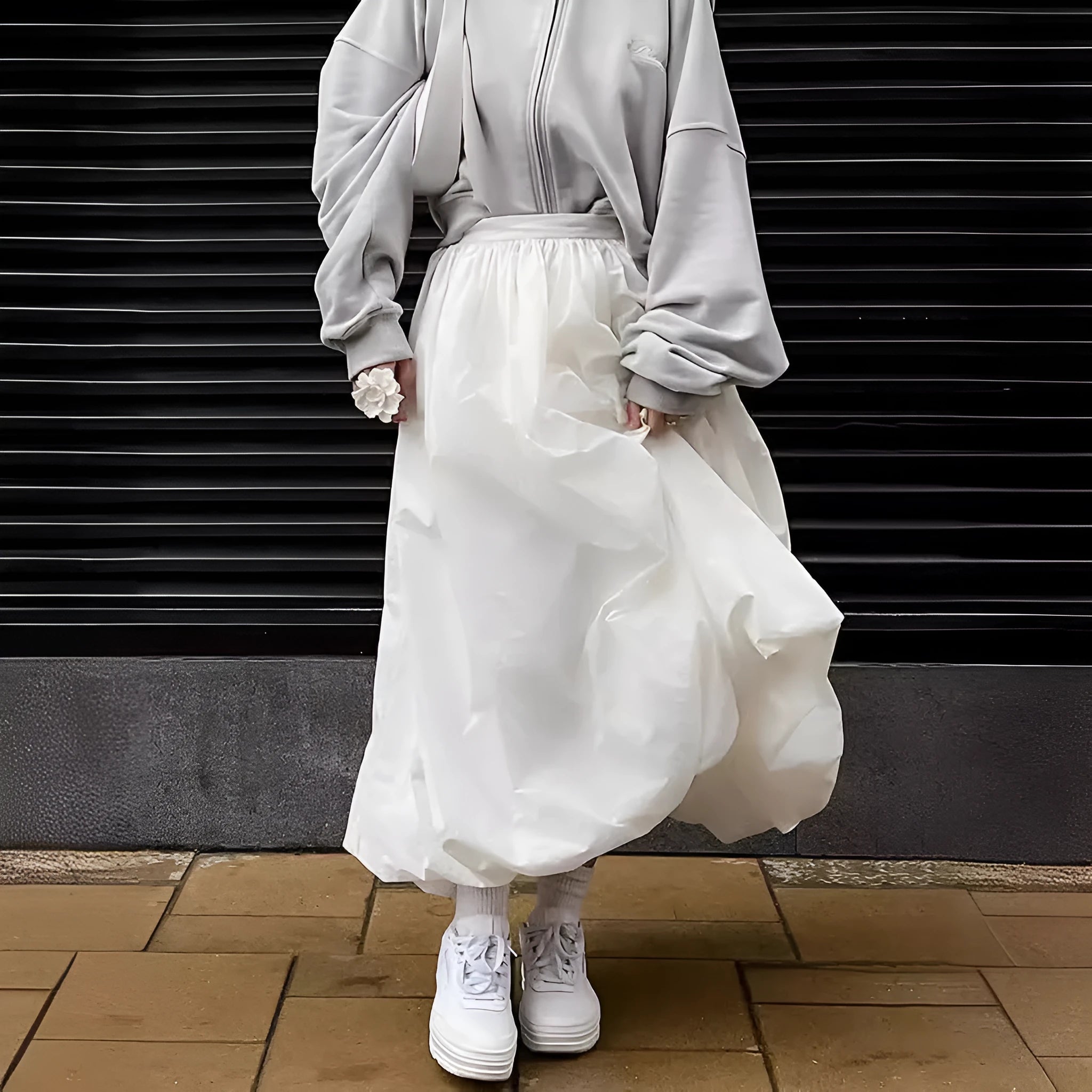 Women's solid colour cotton long skirt with elastic waistband in black or white.