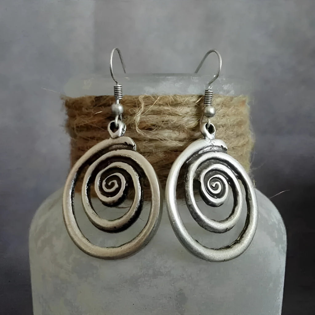 Geometric spiral earrings with distressed silver finish measuring 2.6cm wide by 5cm long
