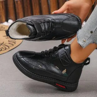 Women's black velvet house slippers with cotton lining and a non-slip rubber sole.