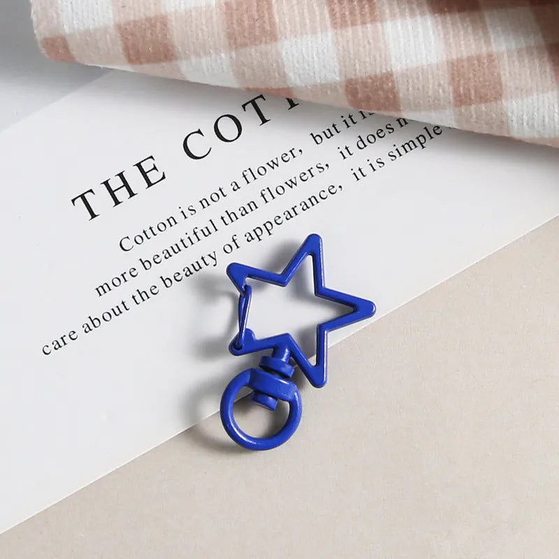 Metal five-pointed star snap button keychain with colour paint finish in alloy, small size, thirteen colour options including beige and sapphire blue