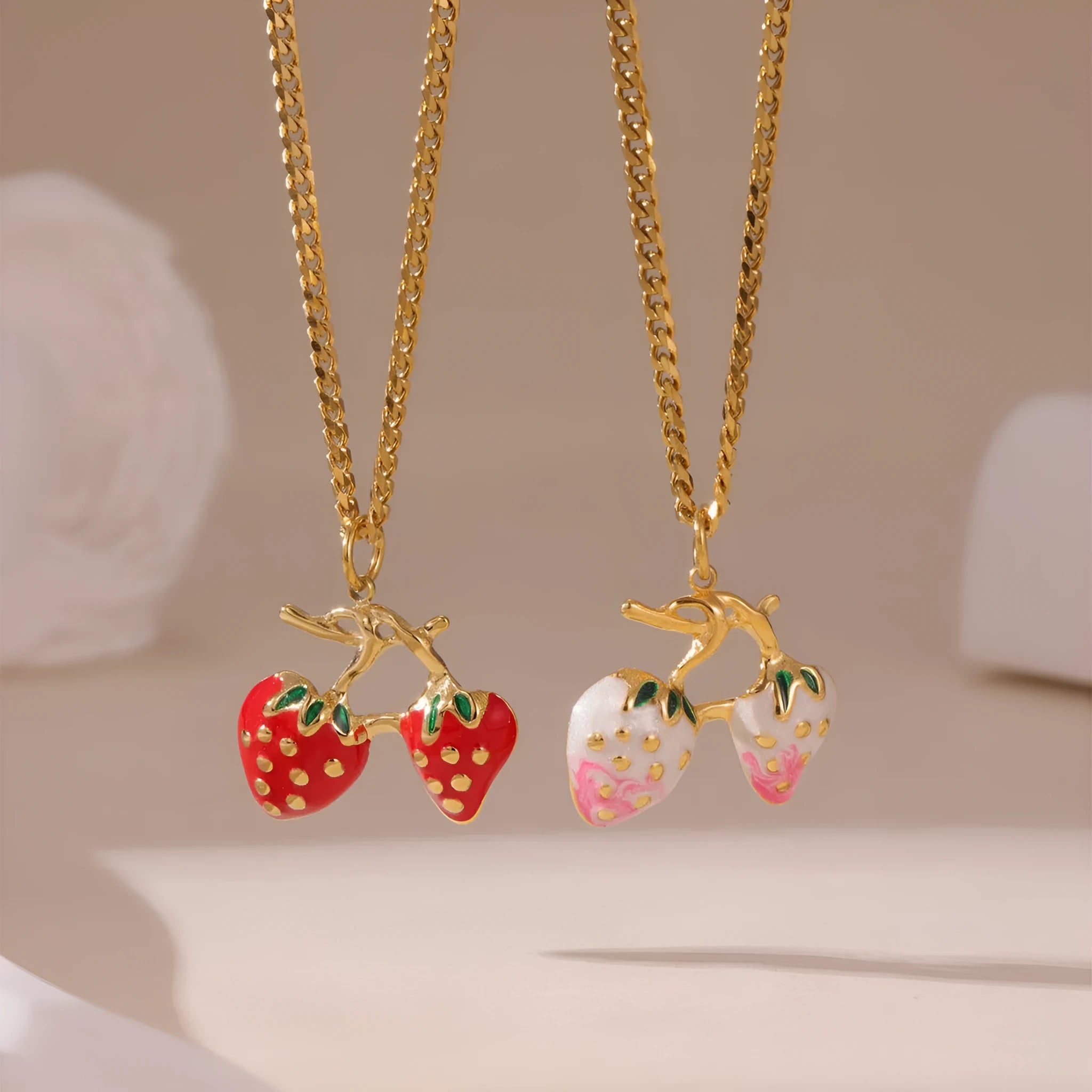 Stainless steel strawberry-shaped pendant necklace on an alloy chain in red or white gradient finish.