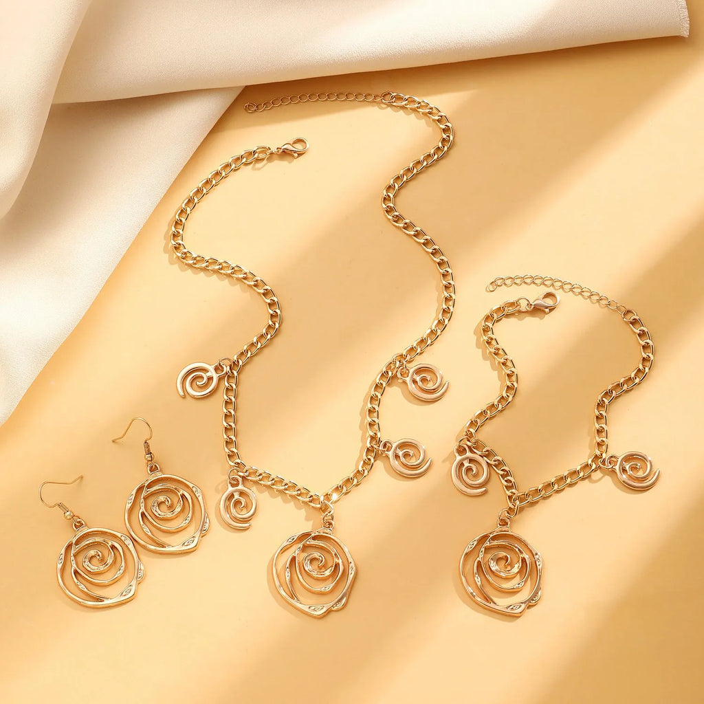 Spiral donut design jewellery set with necklace, bracelet and earrings in gold electroplated alloy