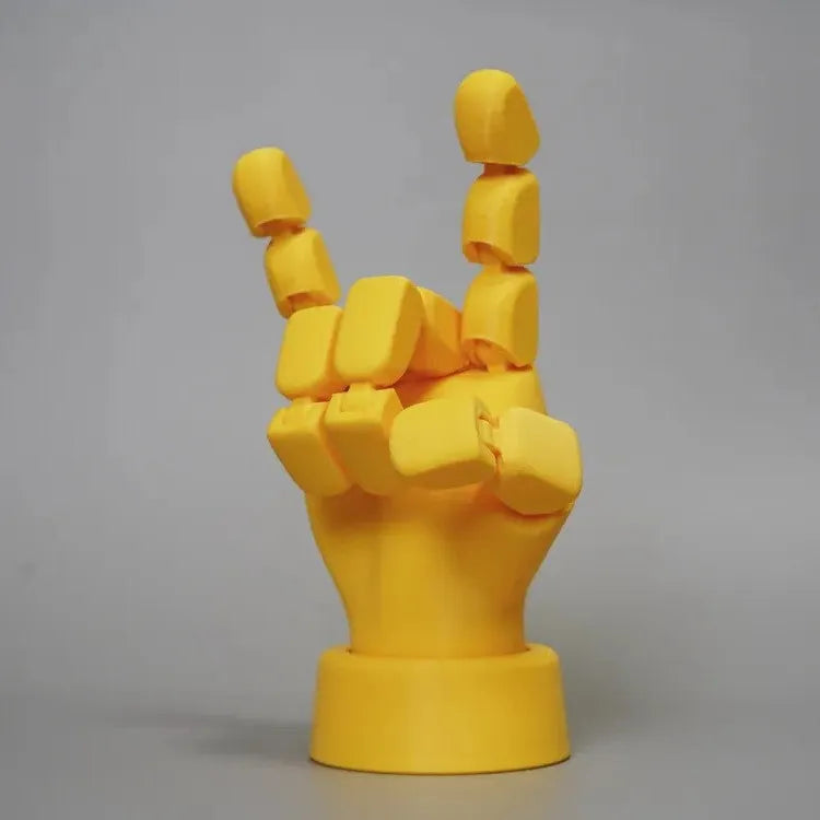 Yellow movable joint hand prop ornament made from PLA plastic.