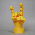 Yellow movable joint hand prop ornament made from PLA plastic.