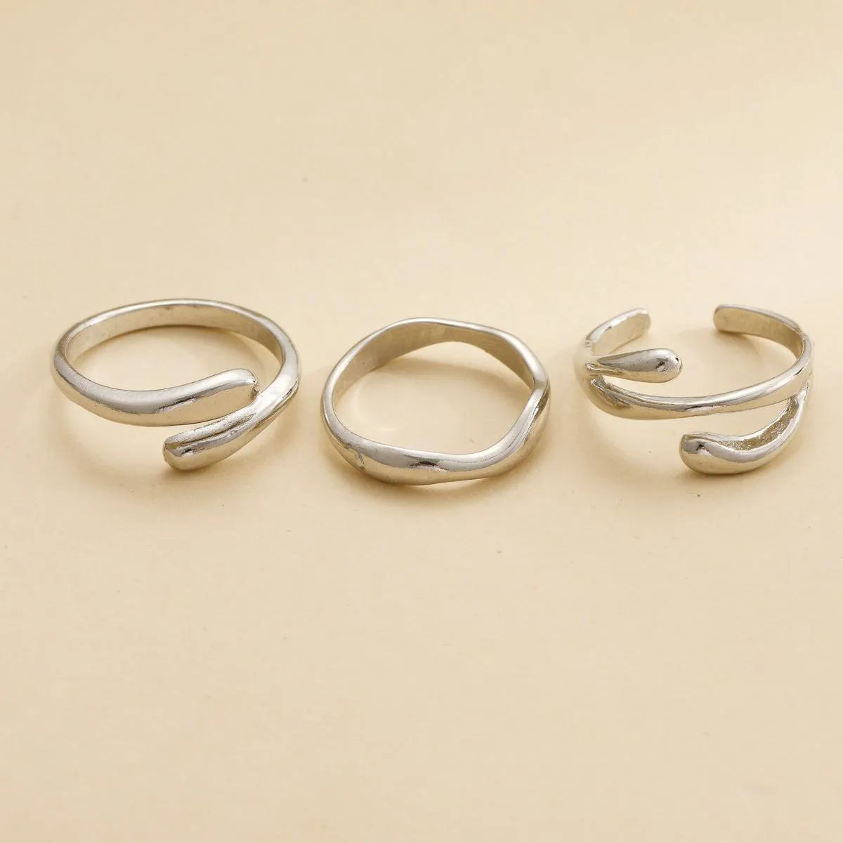 Women's irregular water drop ring suit 3-piece set in gold alloy on white background