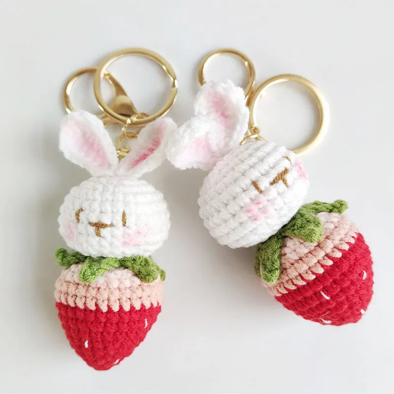 Hand-woven white rabbit strawberry pendant keychain made from four-strand doll wire.