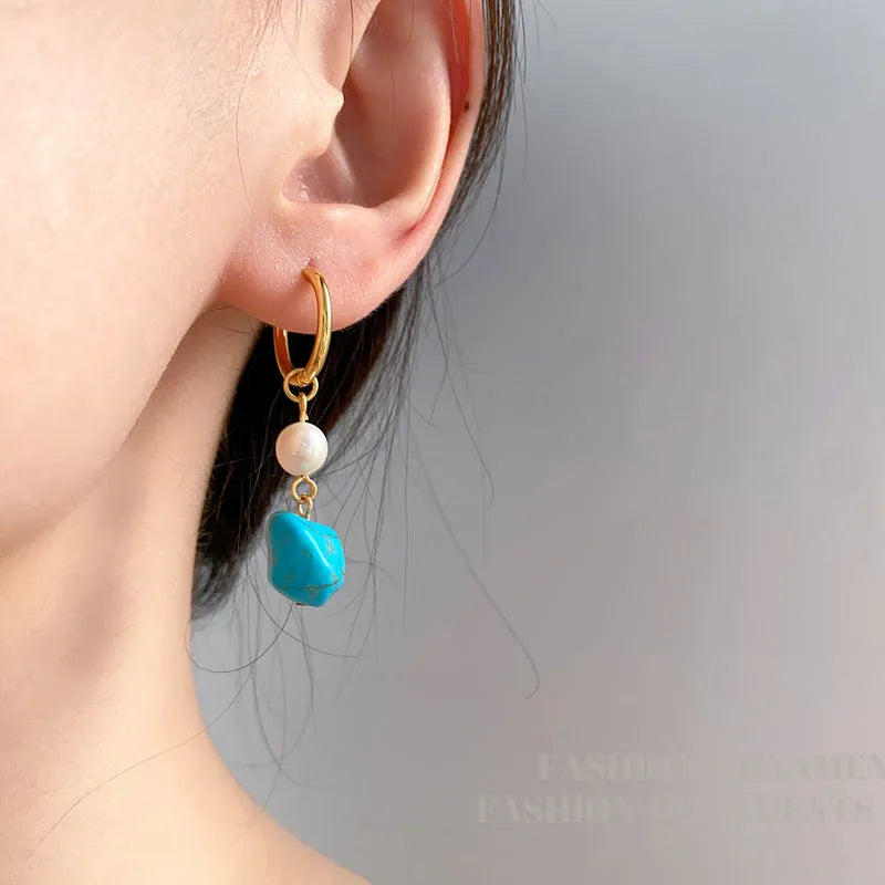 Geometric copper earrings with turquoise stones and cultured pearls, showing both short and long styles.