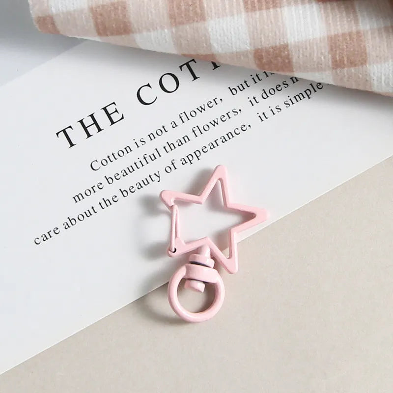 Metal five-pointed star snap button keychain with colour paint finish in alloy, small size, thirteen colour options including beige and sapphire blue