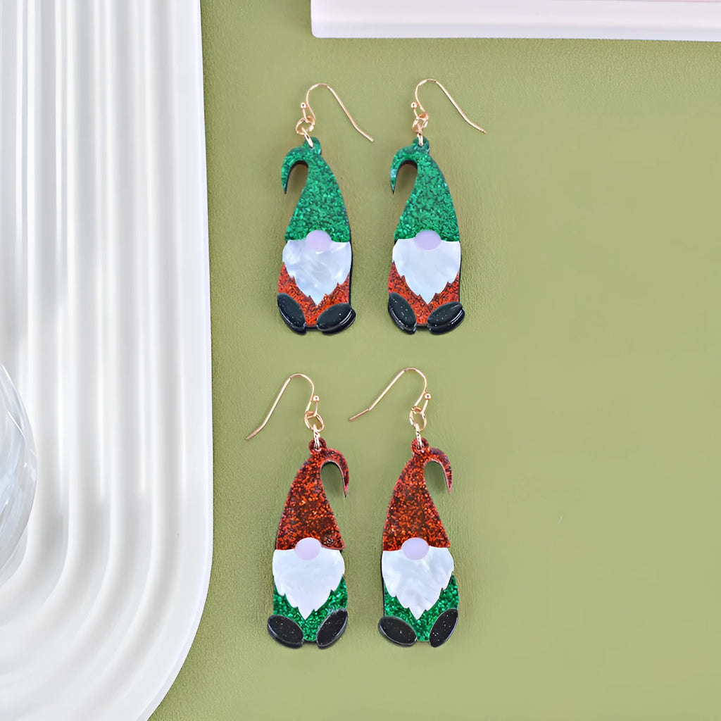 Cartoon Santa Claus character earrings in acrylic with red, green, or mixed hat styles
