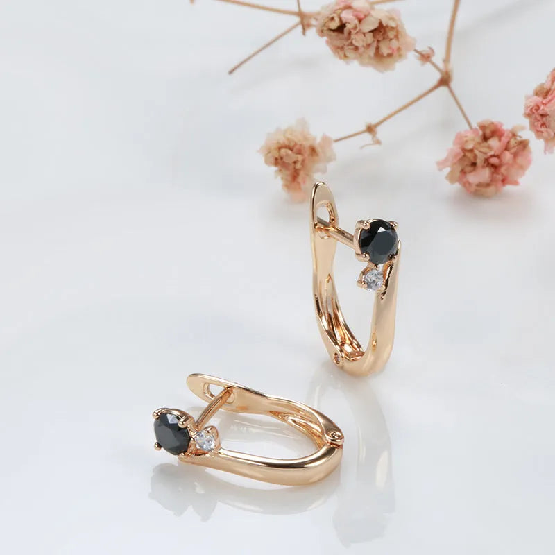 Gold geometric drop shape earrings with black agate stones, retro cold wind style.