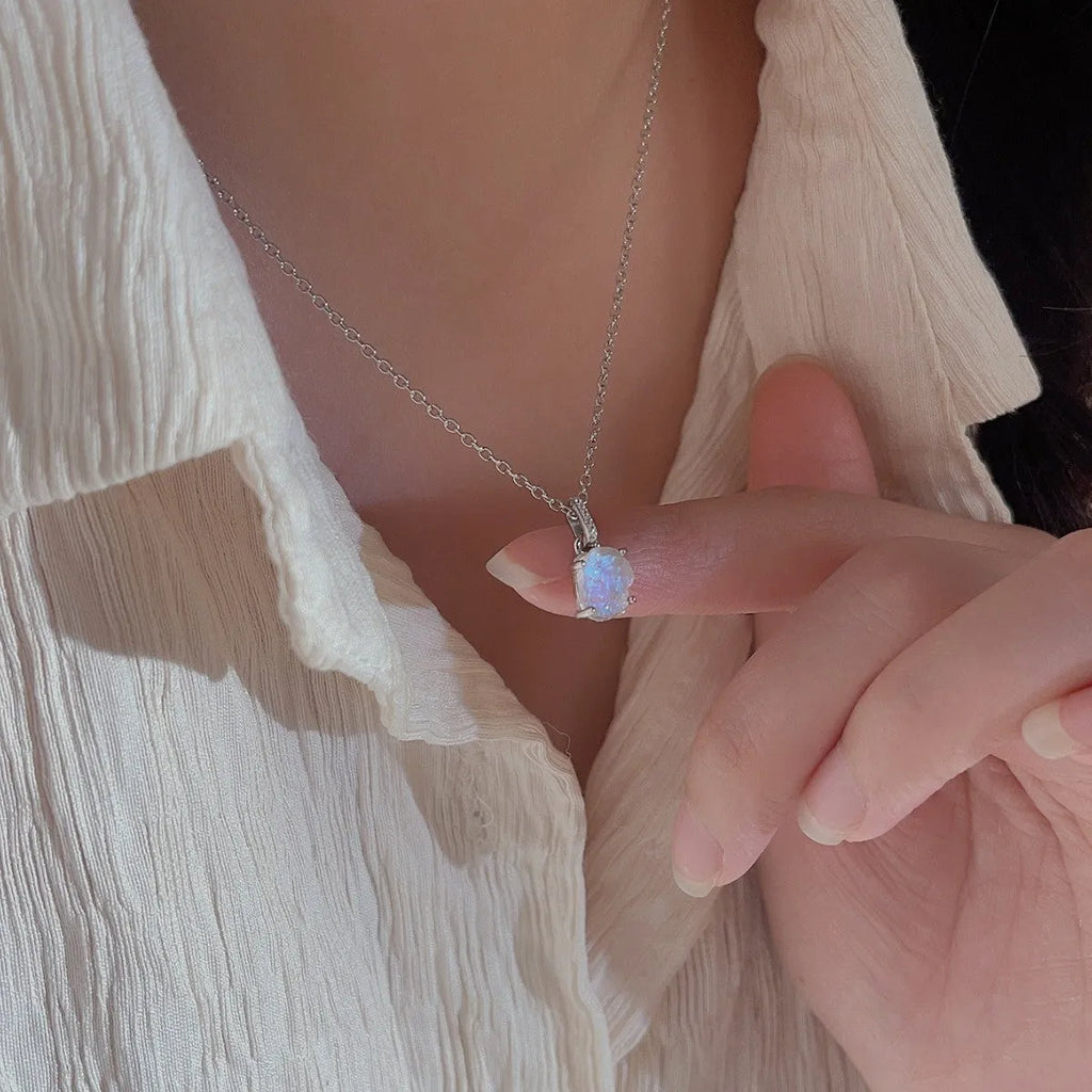 Sterling silver necklace with geometric crystal moonstone pendant on adjustable curb chain