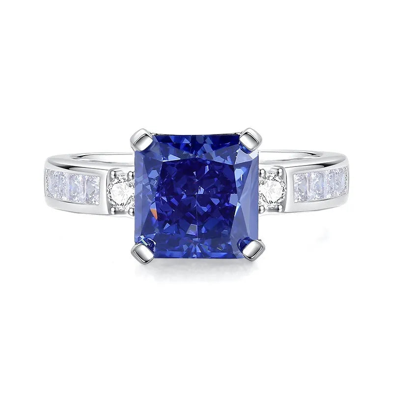Heart-shaped sterling silver ring with a faceted colour zircon stone on a white background.