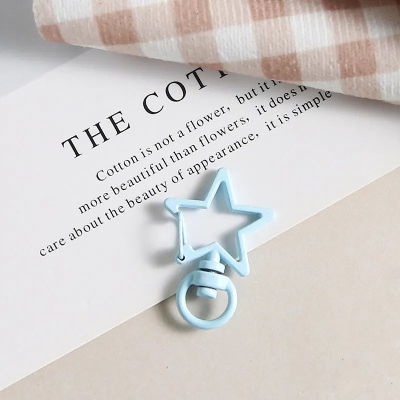 Metal five-pointed star snap button keychain with colour paint finish in alloy, small size, thirteen colour options including beige and sapphire blue