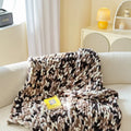 Thick handmade chenille stripe throw blanket in Caramel Mango colour, 130x170cm, on a bed