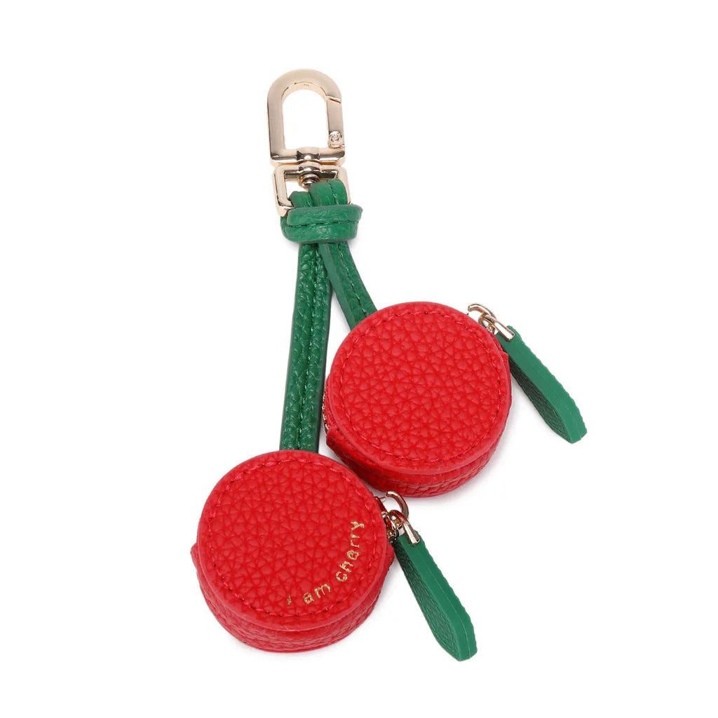 Mini solid colour PU leather coin pouch keychain in cherry red on a keyring.