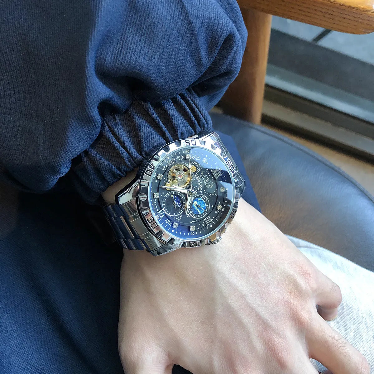 Men's silver case automatic mechanical watch with black leather strap and luminous display