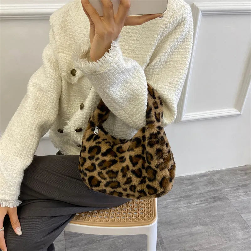 Plush retro shoulder bag in zebra print with single strap and polyester lining
